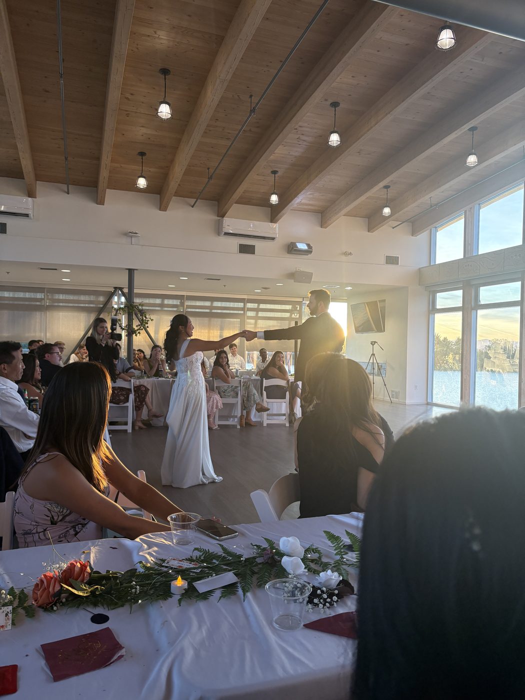The couple stepping onto the floor for their first dance